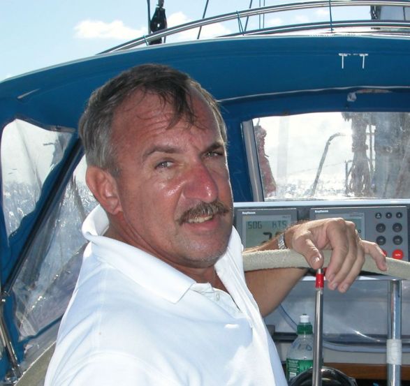 Capt. Bob Cook at the helm beside the boat's navigation instruments