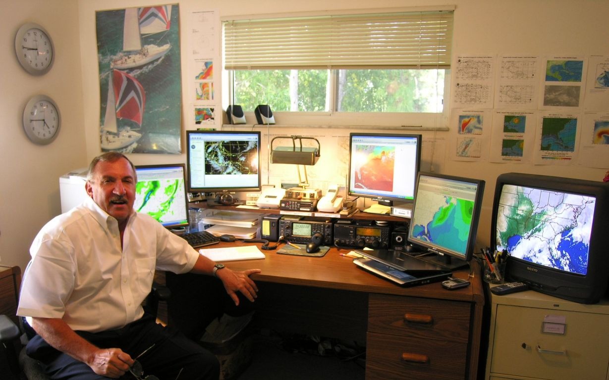 Capt. Bob Cook at his South Florida weather routing office, monitoring multiple weather displays